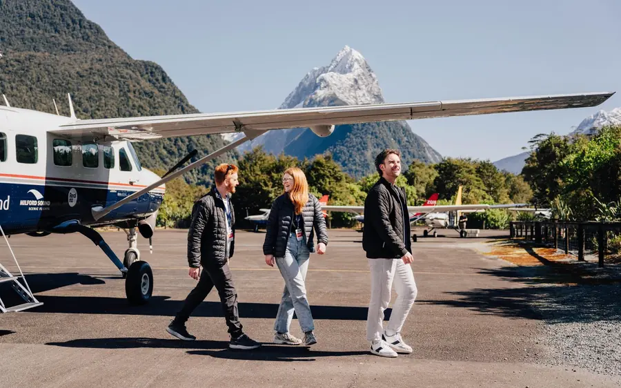 Passengers walking out to the aircraft for a Milford Sound flight